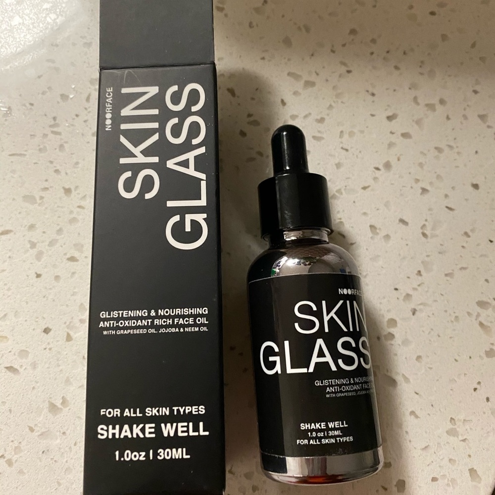 Full bottle of skin glass by Noor Face